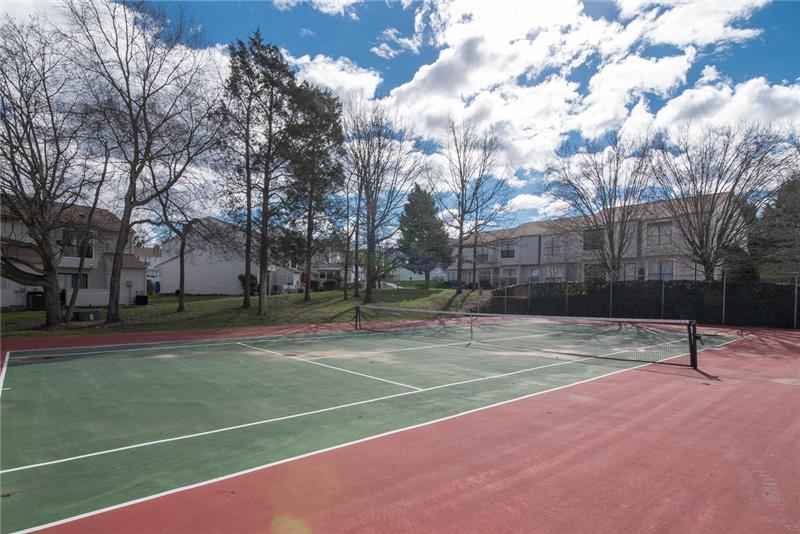Soak up the sun on the community tennis courts.