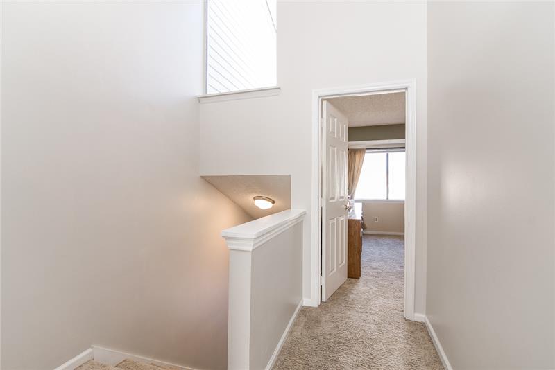 An extra window in the upstairs hallway continues to provide bright sunlight throughout the home.