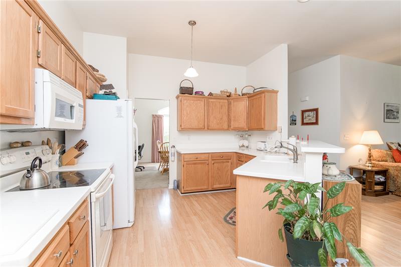 The spacious kitchen opens into the great room.