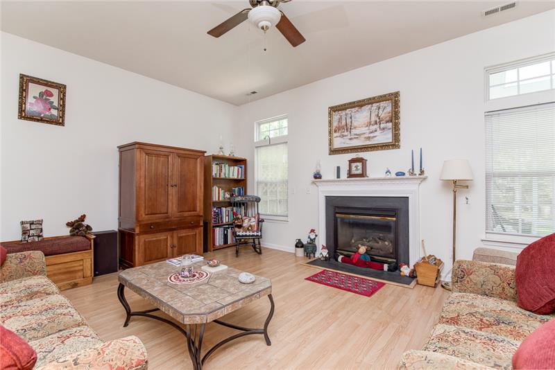You'll love this great room with the laminate wood flooring and cozy gas fireplace.