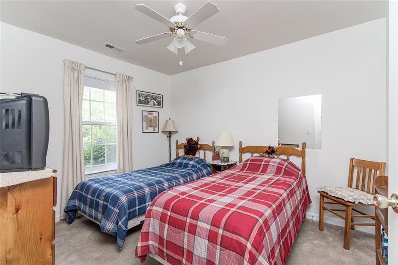The secondary bedrooms also each include a ceiling fan and large closet.