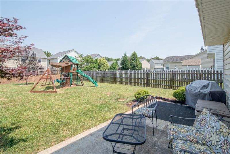 The backyard is completely enclosed and provides privacy.