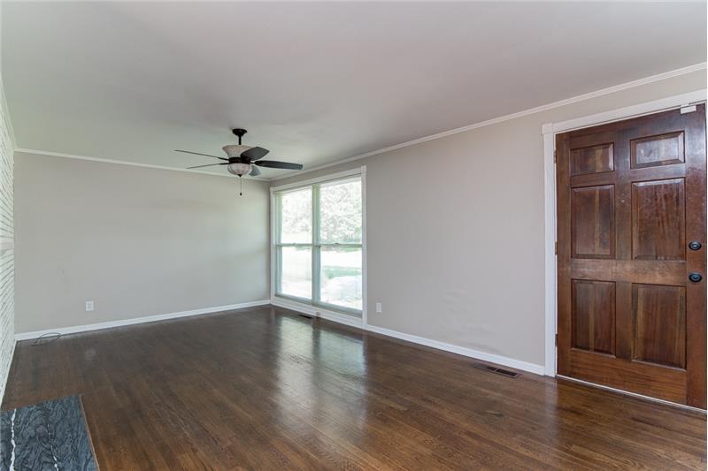 The great room includes fabulous hardwood floors and neutral colors.
