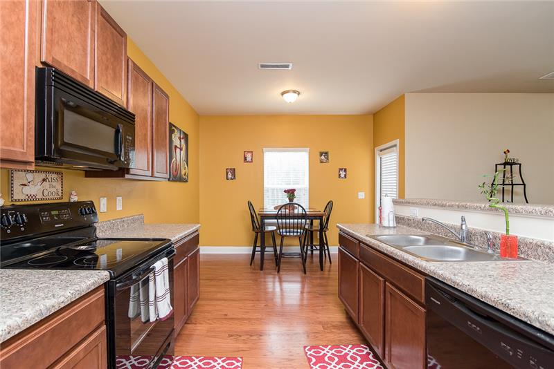 Hardwood floors are found through the kitchen and dinette area.