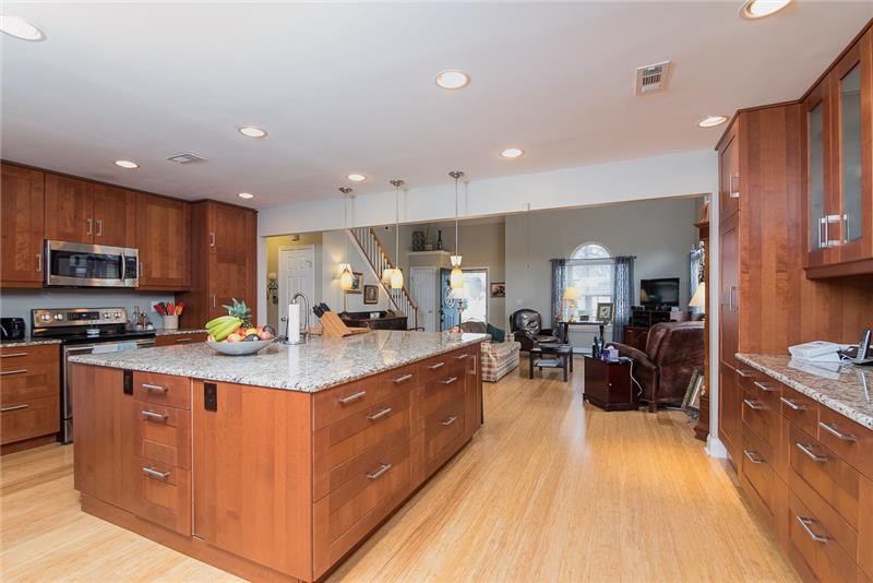 The huge kitchen island includes extra built in storage and room for seating.