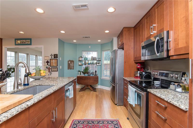 Stainless steel appliances and granite countertops are two beautiful finishing features of the kitchen.