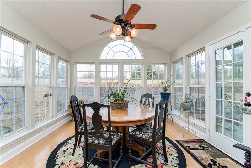 The sunroom is the perfect place for dining, morning coffee or enjoying a sunny afternoon.