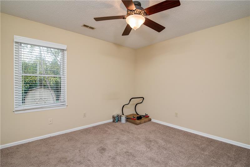 Both secondary bedrooms are spacious and include a ceiling fan.