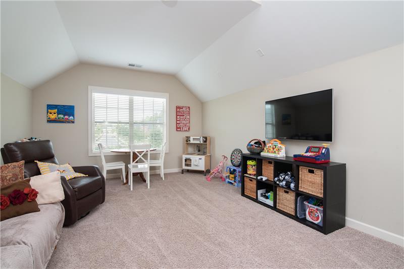It's game time!  This bonus room is perfect for watching the game on the weekend, a kids playroom or a home office.