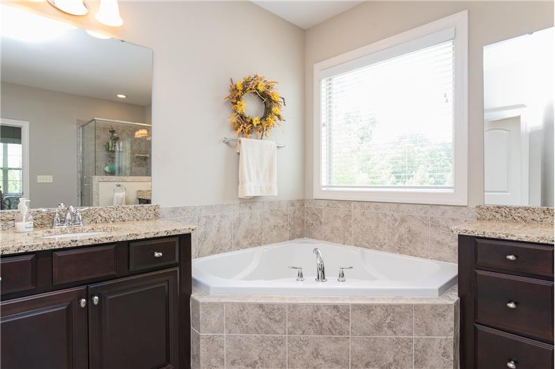 Enjoy his and hers sinks and cabinet storage area.