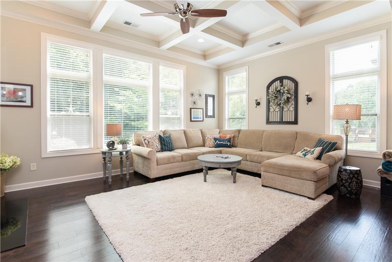 Windows on both sides of the great room make the space sunny and inviting.