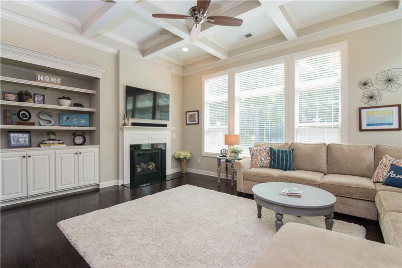 A cozy fireplace and built in bookshelves complete this room which is sure to be the center of your home.