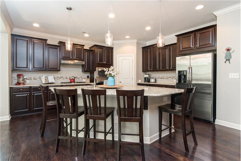 This gourmet kitchen fulfills every chef's dream with he huge granite island, ss appliances and a brand new Bosch dishwasher!