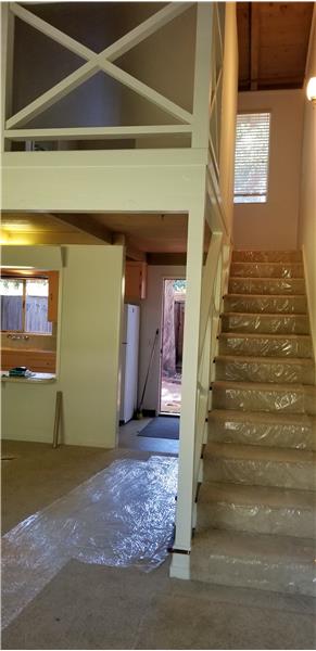 Stairs up to loft and back patio in rear