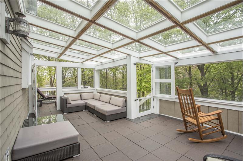 Enclosed porch overlooking water