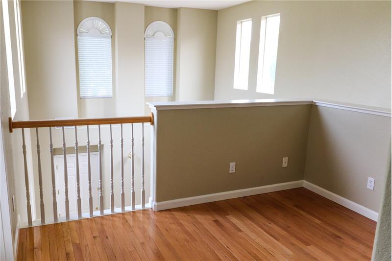 This spacious landing could be a wonderful home office or kid's homework station!