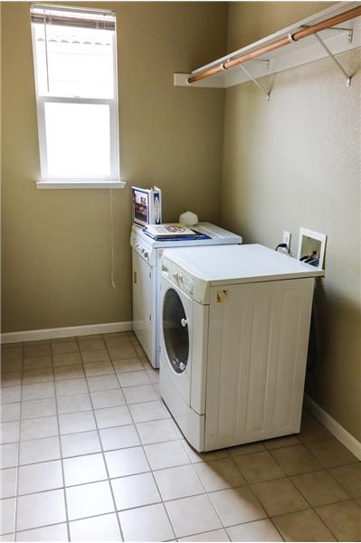 Spacious laundry upstairs where all of the bedrooms reside for convenience! We're even throwing in the washer and dryer for you!