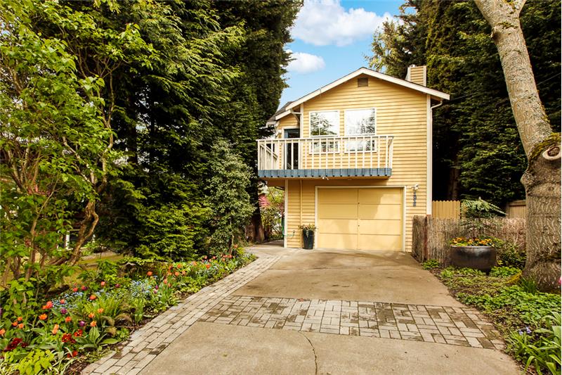 Welcome to this well-cared for Wallingford home surrounded by trees and gardens!