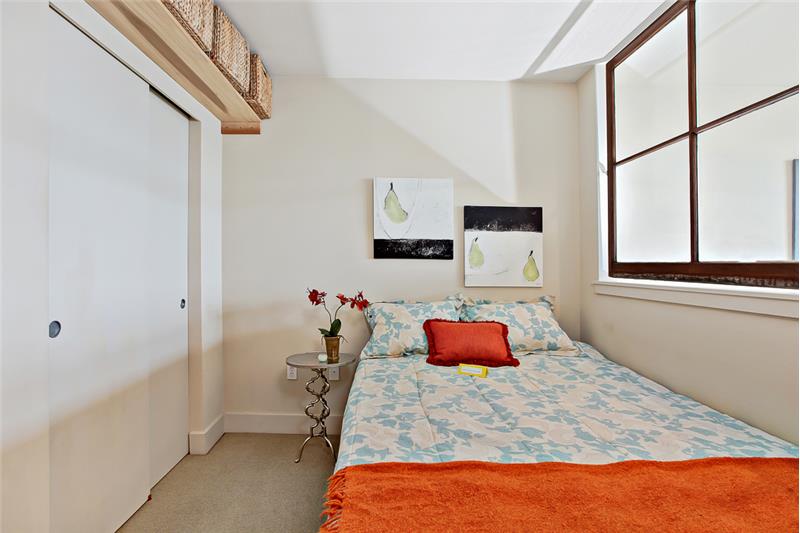 Large closet space next to bed