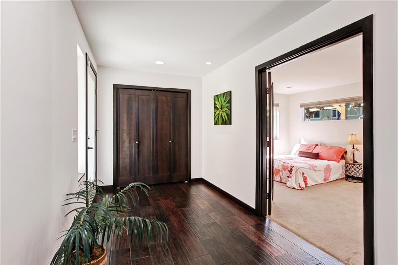 Entry level view into bedroom.  Double door opening.