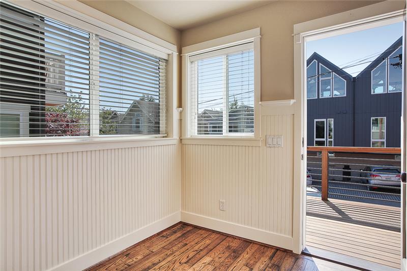 This is the back door, which opens out onto one of two decks in this home.