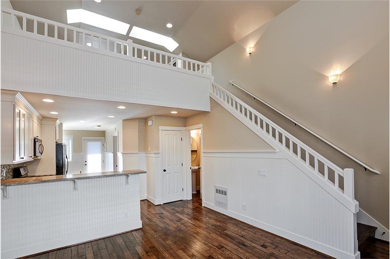 Grand staircase to upstairs master loft bedroom.