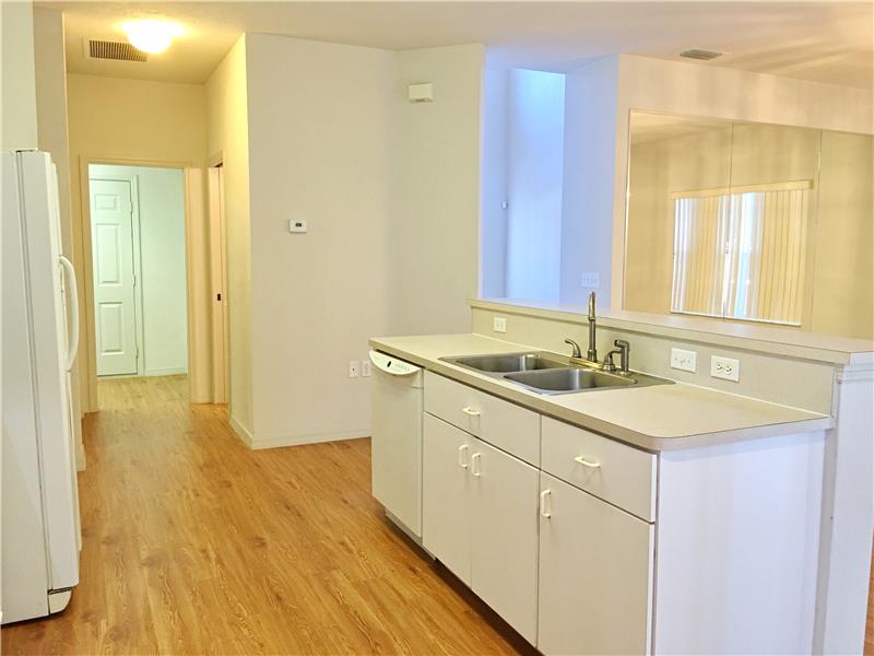 Kitchen to Hall with 1/2 Bath & Laundry Room