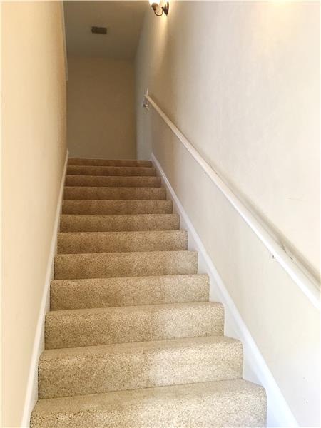 Stairway to Guest Suite over Garage