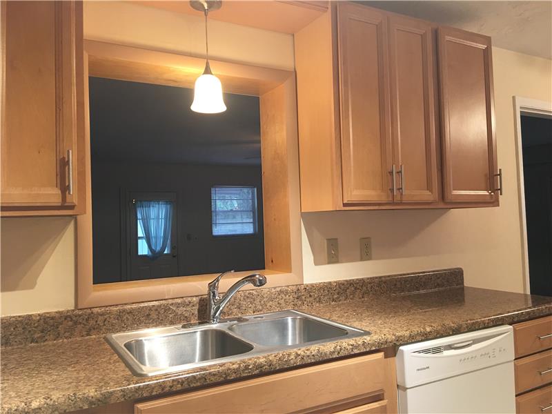 Kitchen Pass Thru Window to Family Room
