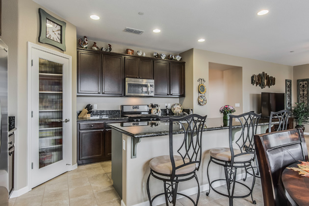 Generous kitchen storage including a pantry.