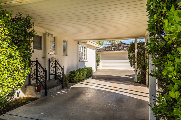 Covered Car Port Leads to Detached 2 Car Garage w/ Workspace