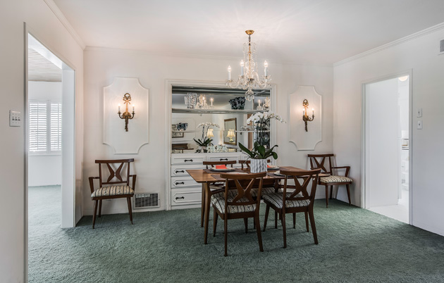 Charming Built-ins, Decorative Moldings and Wall Sconces in the Formal Dining Area