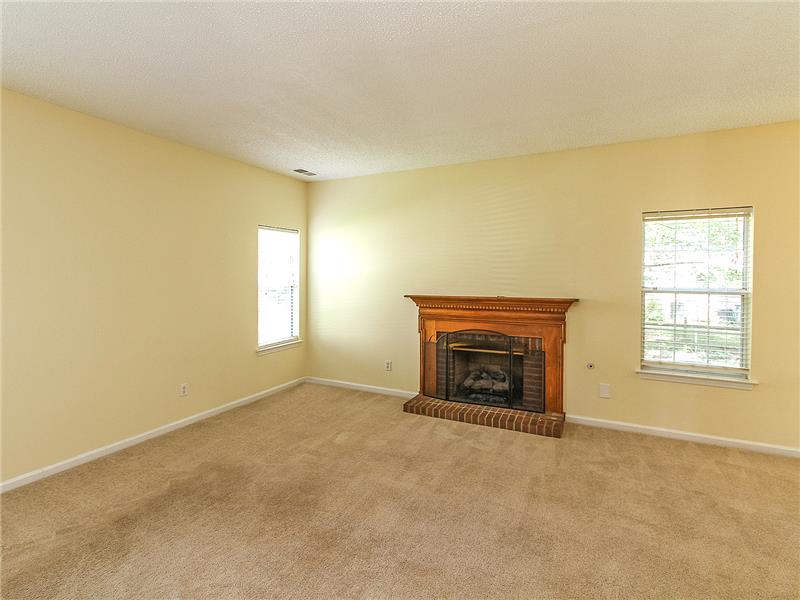 Focal point of great room is gas log fireplace