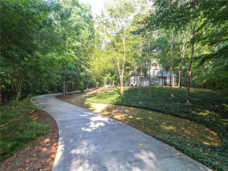 Gracious winding driveway through the trees