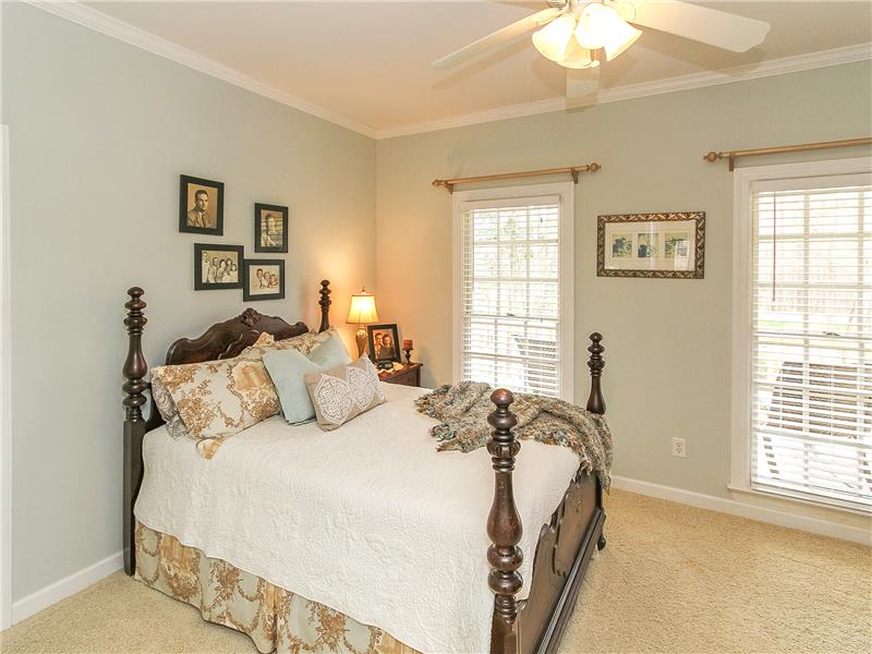 Split bedroom floor plan with two secondary bedrooms and office