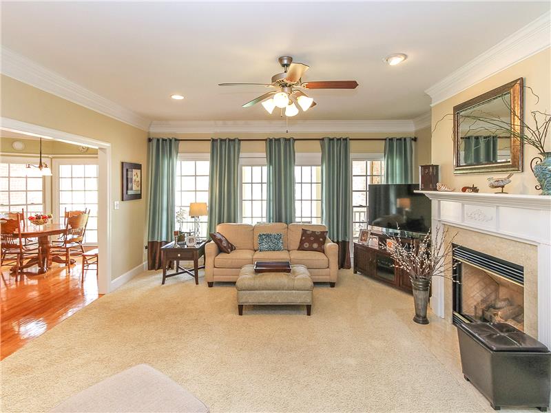 Abundant light in great room from tall windows