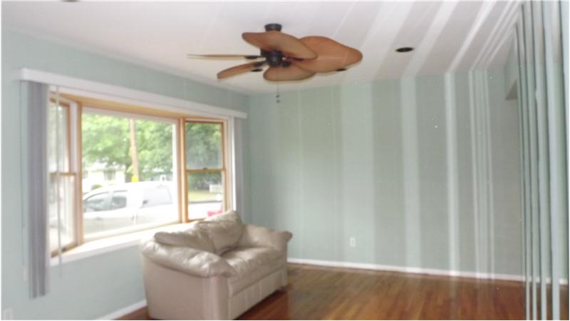 bow window and ceiling fan.