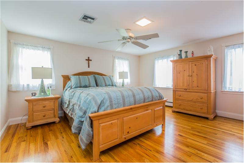 Master bedroom features hardwood floors