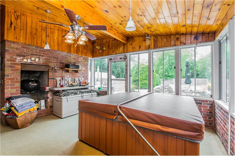 The sunroom features hot tub and indoor grill!