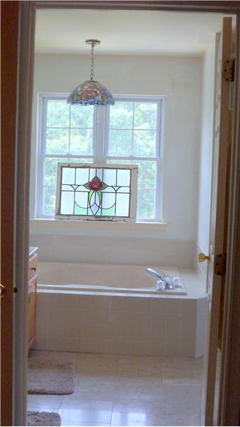 Master bath has marble floor/counter, soaking tub and shower.