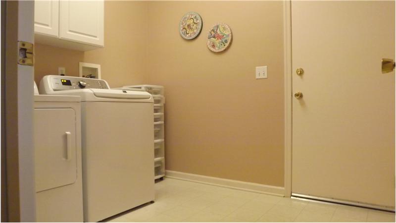Large laundry room with access to garage.