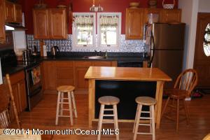 Kitchen features center island seating.