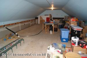 Walk up attic for hobby or play room.