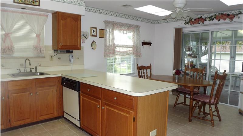 The kitchen has breakfast room and ceramic tile.