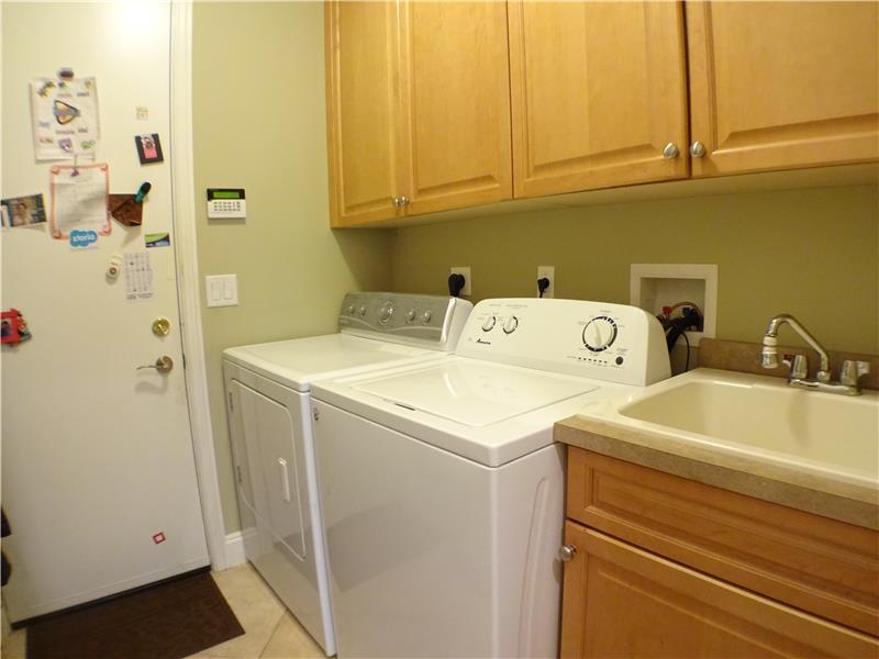Wash Room With Over-Sized Cabinets and Slop Sink 