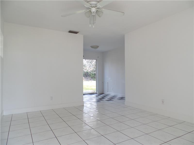 View of Living Room from front door, tiled Living Room