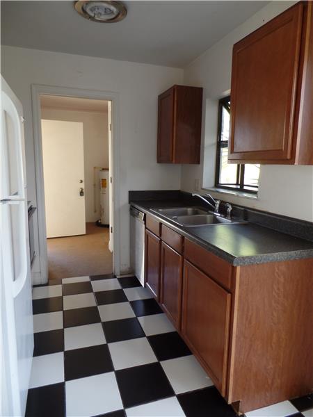 Off the Kitchen is the laundry room