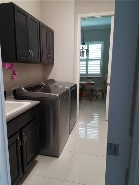 Laundry Room opens to Foyer Area and Eat-in Kitchen Area with pocket doors