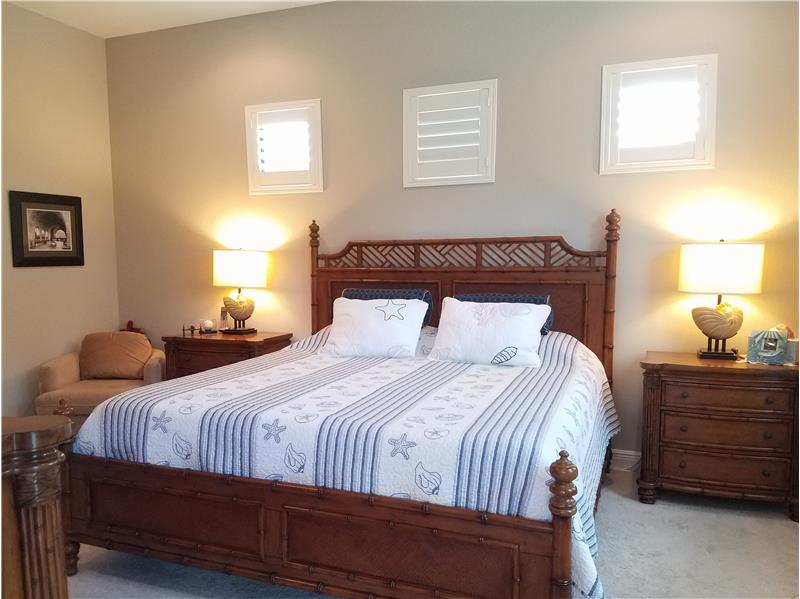 Spacious Master Bedroom with ceiling fan and recess lighting.