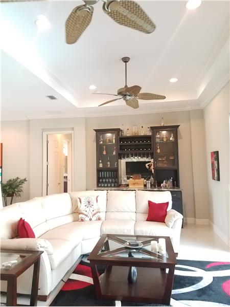 Great Room features recessed lighting, double ceiling fans, and trey ceiling.